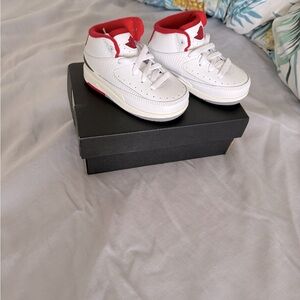 Brand new. Jordan 2 retros 
Baby sneakers